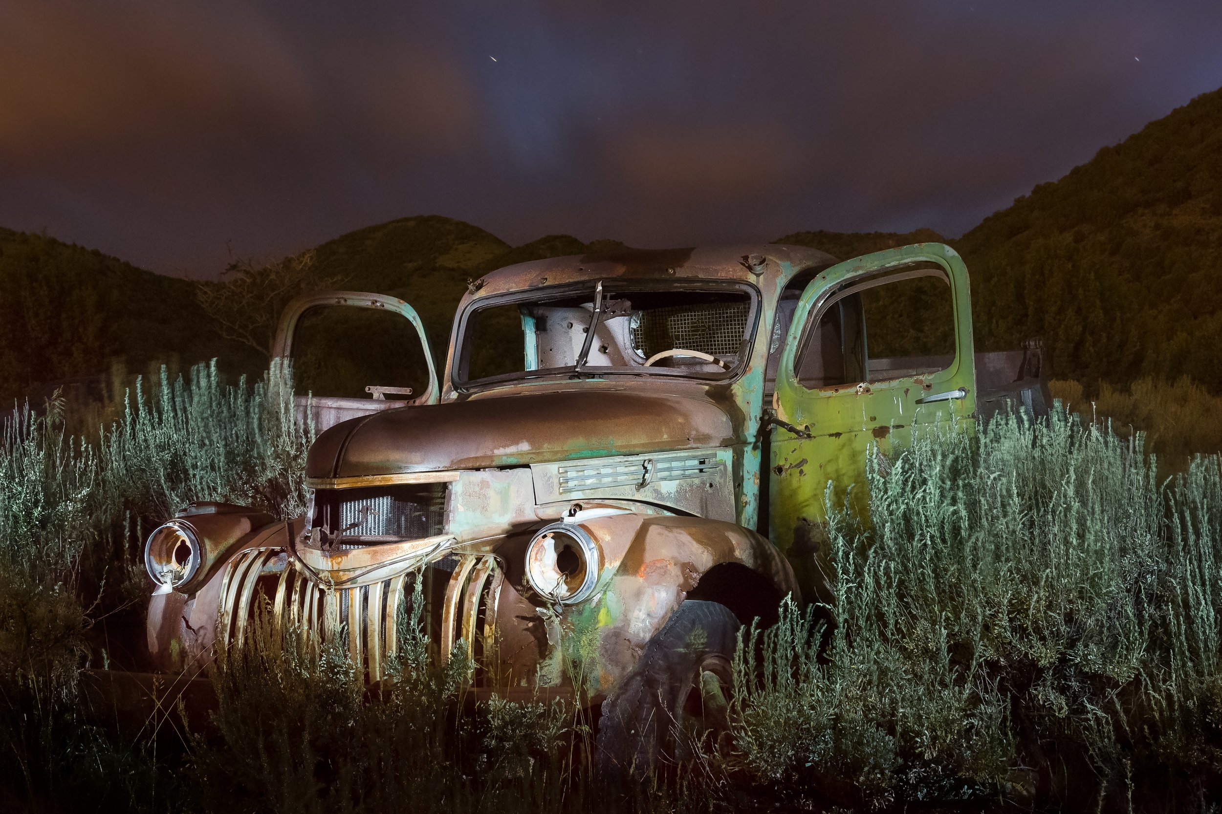 Stansbury Abandoned truck at night by Clay Cammack Photography
